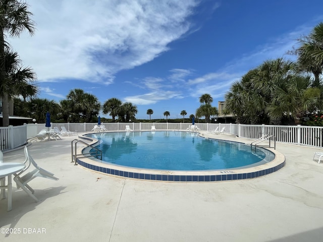 view of swimming pool featuring a patio area