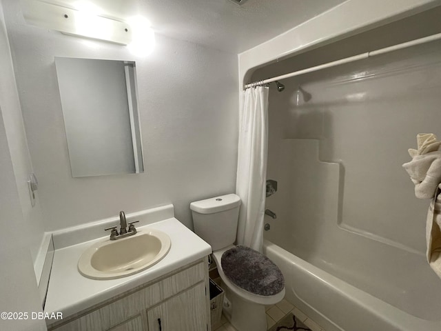 full bathroom featuring tile patterned floors, vanity, toilet, and shower / bath combo with shower curtain