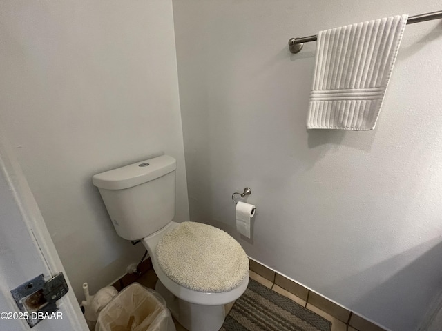 bathroom with tile patterned floors and toilet