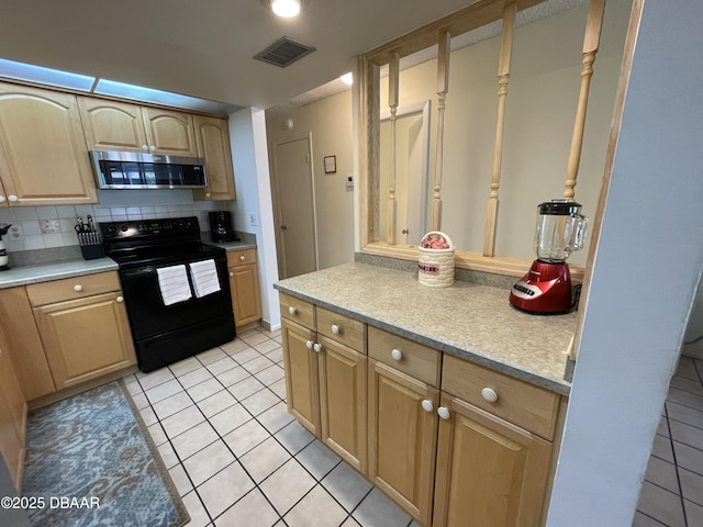 kitchen with decorative backsplash, light brown cabinets, black electric range oven, and light tile patterned floors