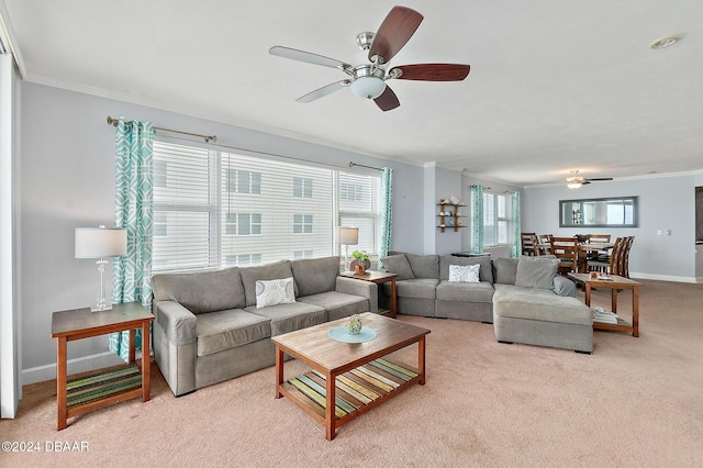 living area featuring crown molding and a ceiling fan