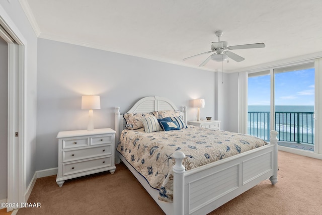 carpeted bedroom with ceiling fan, crown molding, baseboards, a water view, and access to outside