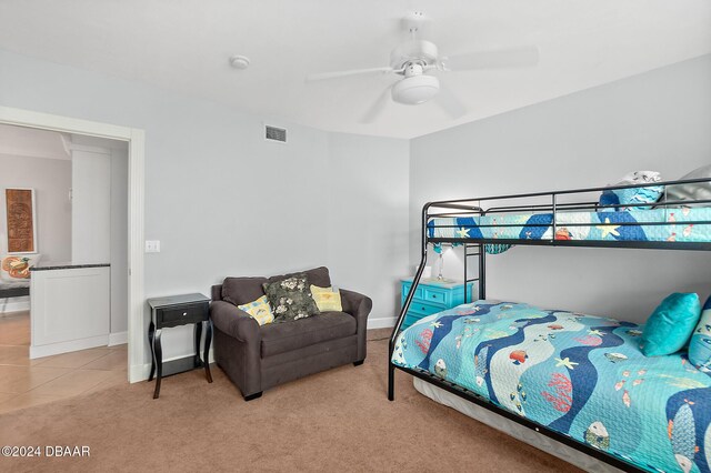 3311 S Atlantic Ave Unit 304, Daytona Beach Shores, FL 32118 - bedroom with baseboards, a ceiling fan, light colored carpet, and visible vents