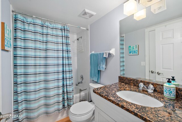 3311 S Atlantic Ave Unit 304, Daytona Beach Shores, FL 32118 - bathroom featuring toilet, visible vents, shower / bath combo, and vanity
