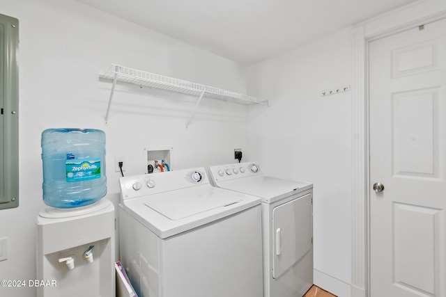 laundry area featuring separate washer and dryer and laundry area