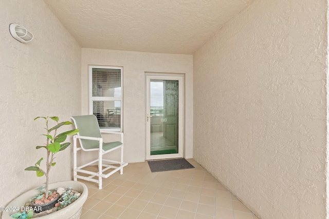 entrance to property with stucco siding