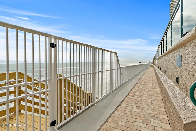 view of community featuring a water view and a view of the beach