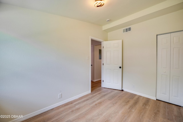 259 Jefferson St, Daytona Beach, FL 32114 - unfurnished bedroom featuring light wood-style flooring and a closet