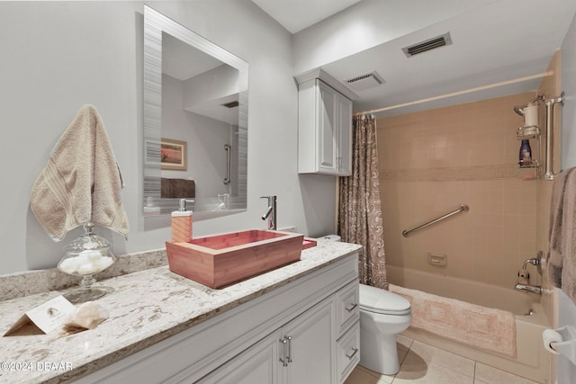 full bathroom with toilet, vanity, tile patterned floors, and shower / bathtub combination with curtain