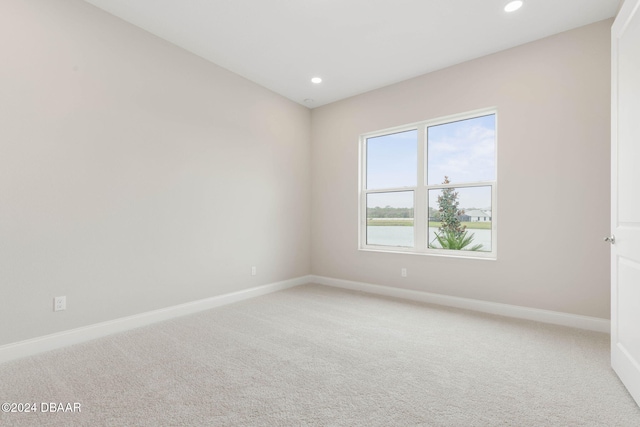 unfurnished room featuring carpet flooring