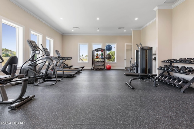 workout area featuring ornamental molding