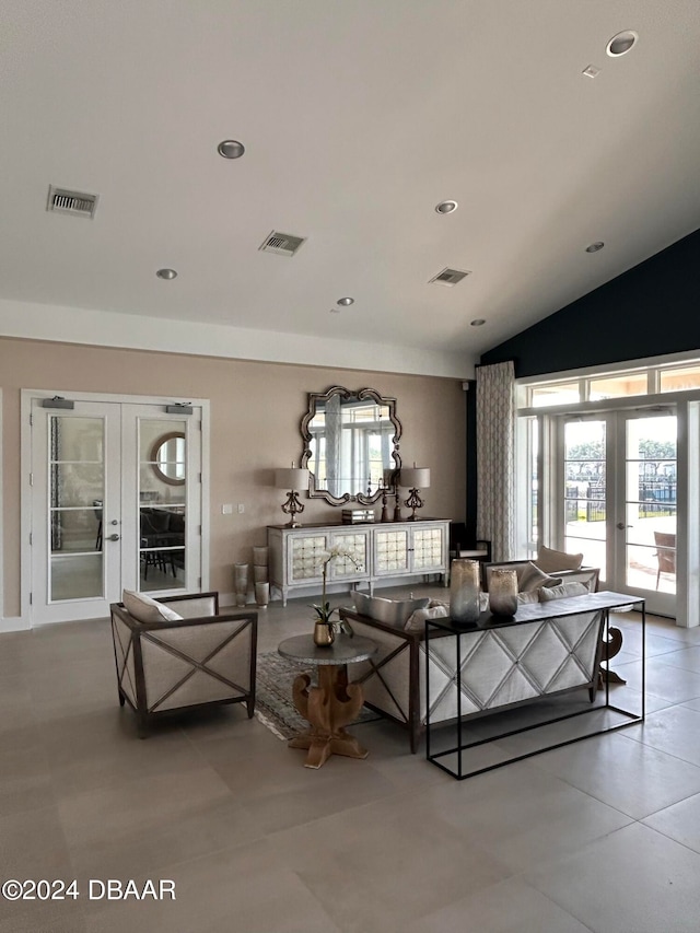 living room with french doors and vaulted ceiling