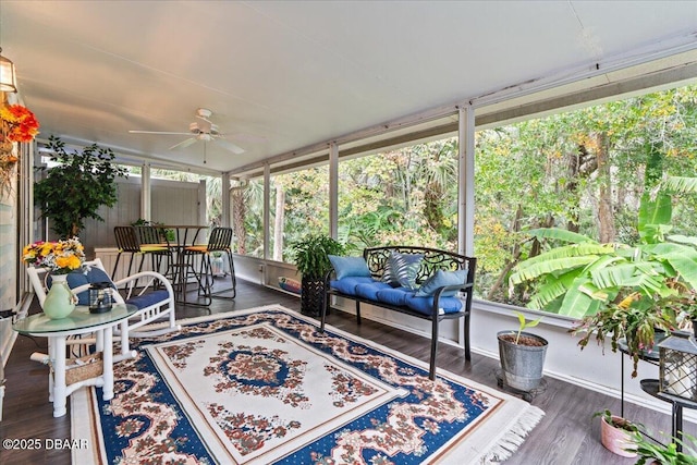 sunroom with a wealth of natural light and ceiling fan