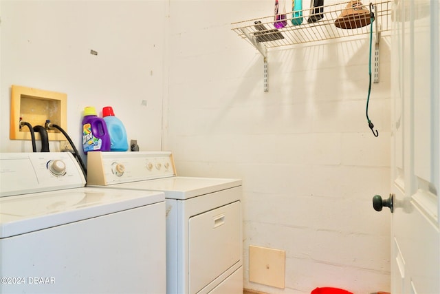 clothes washing area featuring independent washer and dryer