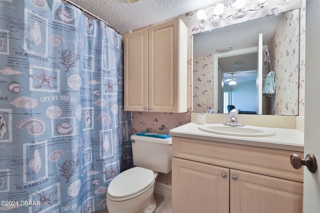 bathroom with vanity, walk in shower, a textured ceiling, and toilet