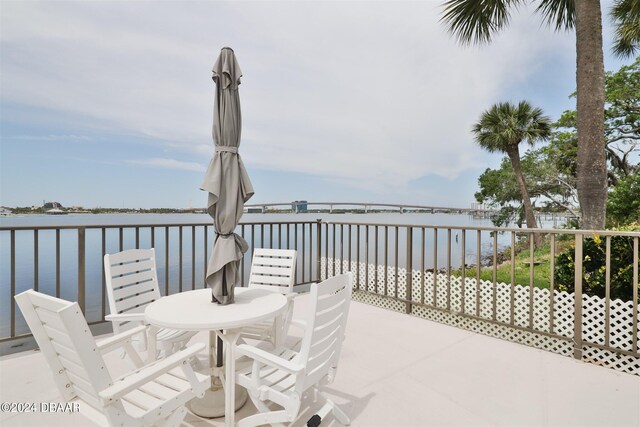 view of patio with a water view