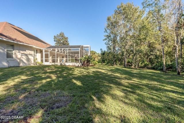 view of yard featuring glass enclosure