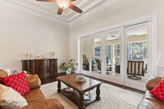 living room with crown molding, wood finished floors, baseboards, ceiling fan, and french doors