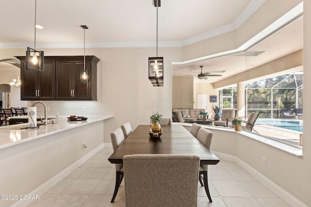 dining space with ornamental molding, ceiling fan, and light tile patterned floors