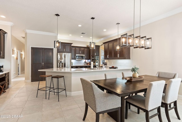 dining space featuring crown molding, recessed lighting, and visible vents
