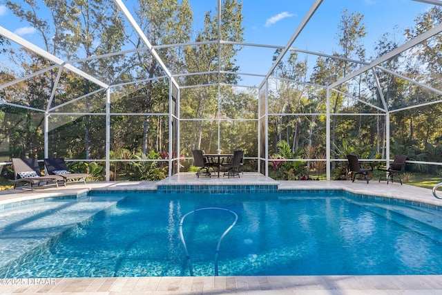 outdoor pool with a patio and a lanai