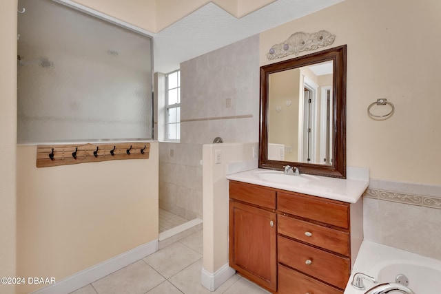 bathroom with tile patterned flooring, vanity, separate shower and tub, and tile walls