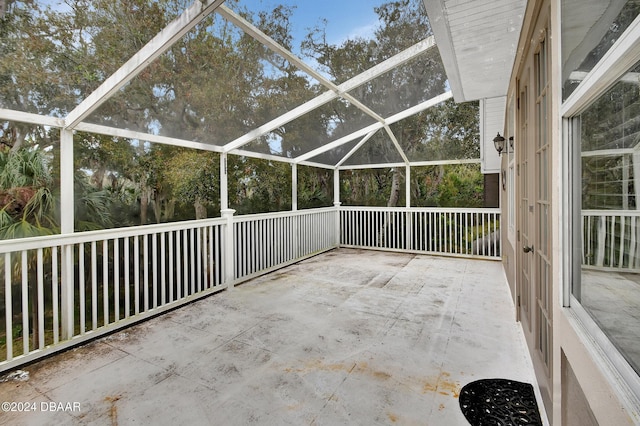 view of patio featuring a lanai