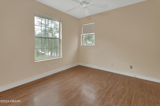 empty room featuring hardwood / wood-style flooring and ceiling fan