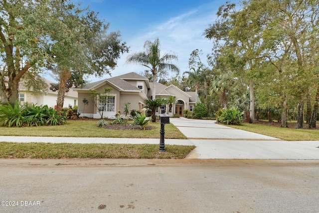 view of front of home with a front lawn