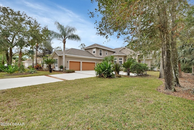 view of front of home with a garage and a front yard