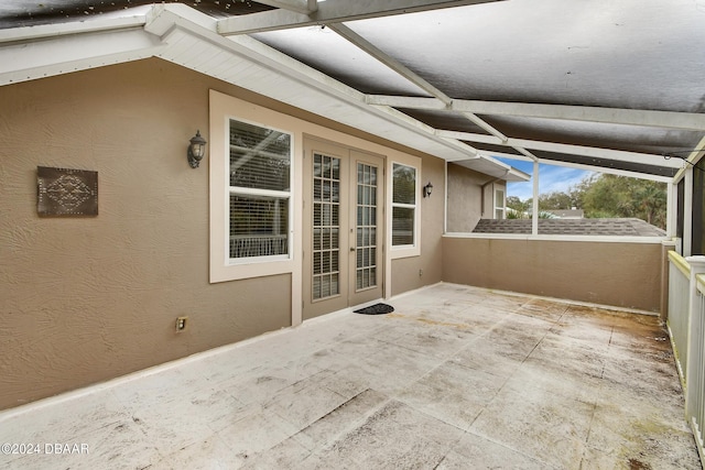 unfurnished sunroom featuring lofted ceiling