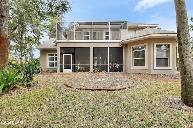 back of house with a lawn