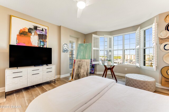 bedroom featuring ceiling fan and light hardwood / wood-style flooring