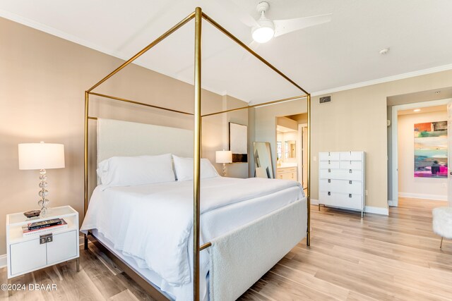 bedroom featuring hardwood / wood-style floors, ceiling fan, and ornamental molding