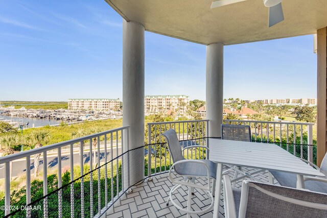 balcony featuring a water view