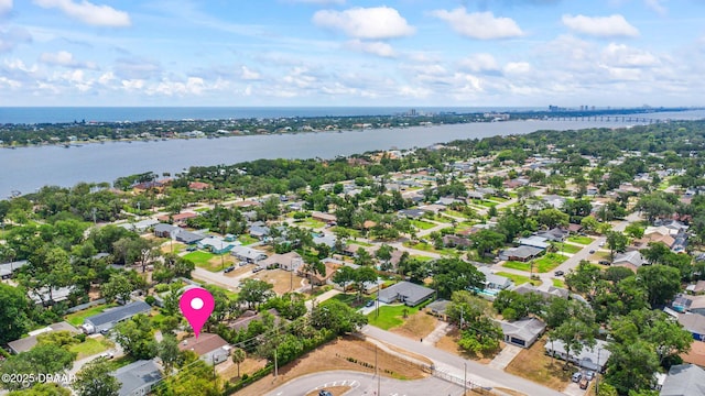 aerial perspective of suburban area featuring a nearby body of water