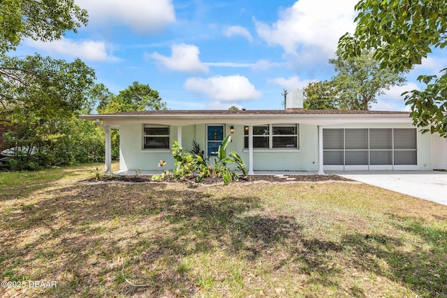 single story home featuring an attached garage, concrete driveway, stucco siding, and a chimney