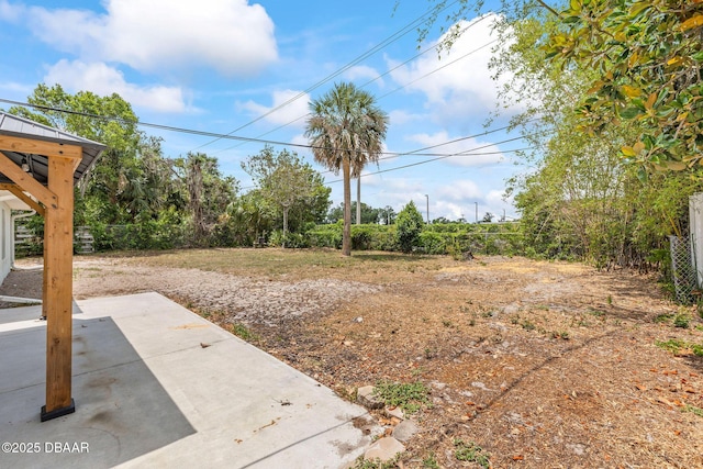 view of yard with a patio and fence