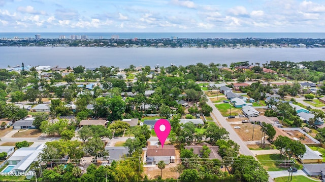 aerial perspective of suburban area featuring a large body of water