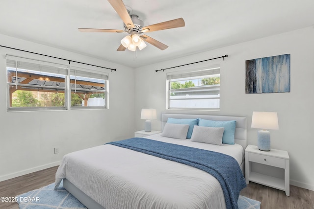 904 Woodmere Cir, Ormond Beach, FL 32174 - bedroom featuring baseboards, wood finished floors, and ceiling fan