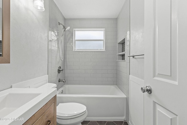 bathroom with toilet,  shower combination, tile patterned floors, and vanity