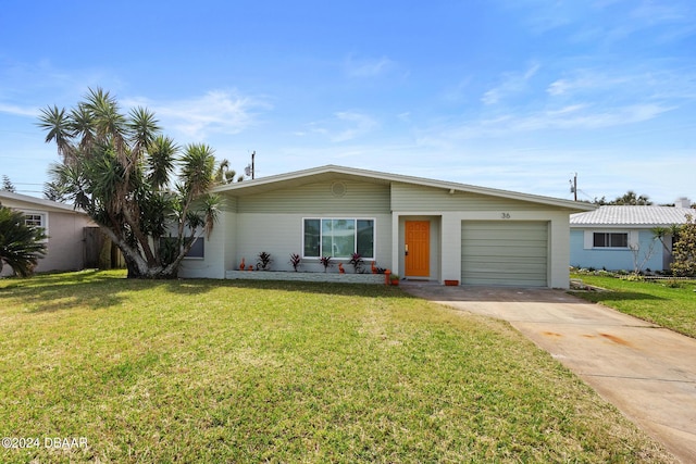 ranch-style house featuring a garage and a front yard