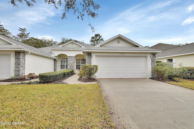 single story home with an attached garage, driveway, stone siding, stucco siding, and a front yard