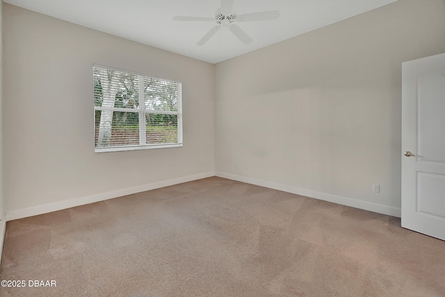 unfurnished room with carpet floors, ceiling fan, and baseboards