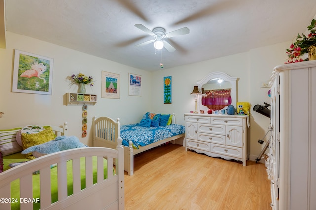 bedroom featuring light wood-type flooring and ceiling fan