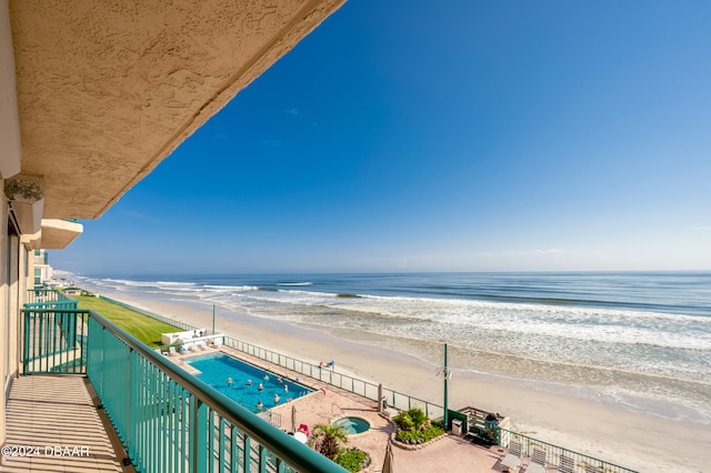 balcony with a view of the beach and a water view