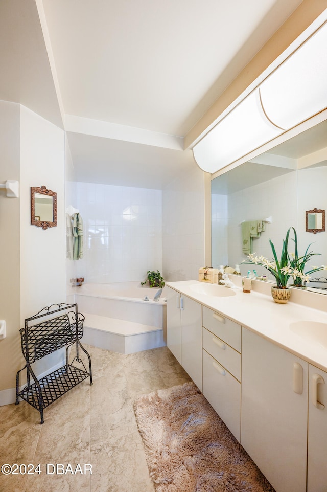 bathroom with a bathing tub and vanity