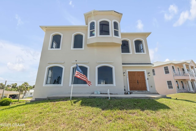 4690 S Atlantic Ave, Ponce Inlet, FL 32127 - view of front of house featuring a front lawn and stucco siding