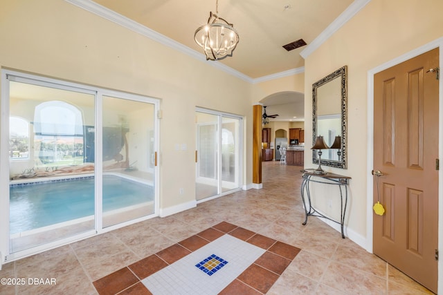 4690 S Atlantic Ave, Ponce Inlet, FL 32127 - unfurnished sunroom featuring arched walkways and a chandelier