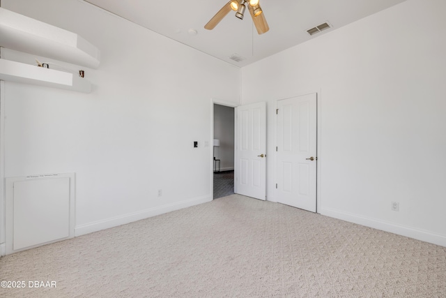 4690 S Atlantic Ave, Ponce Inlet, FL 32127 - carpeted empty room featuring baseboards and ceiling fan